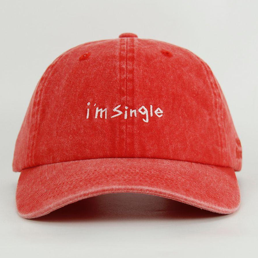Red washed cap with 'i'm Single' text on a light gray background