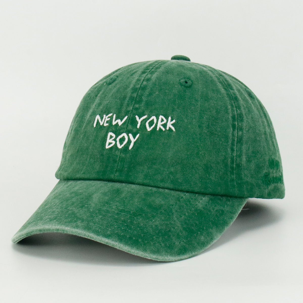 Green washed baseball cap with 'NEW YORK BOY' embroidered on the front