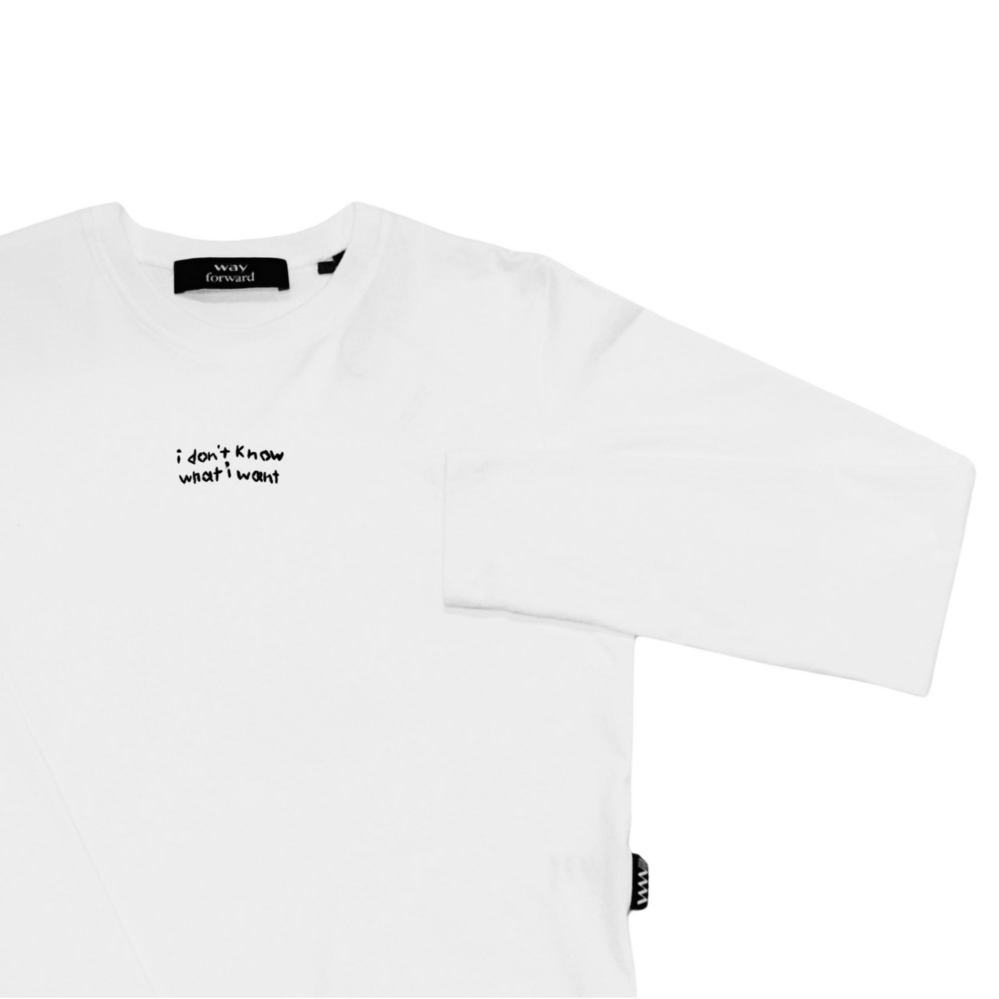 White long sleeve crop tee with black embroidery text 'I don't know what I want' on the chest area.