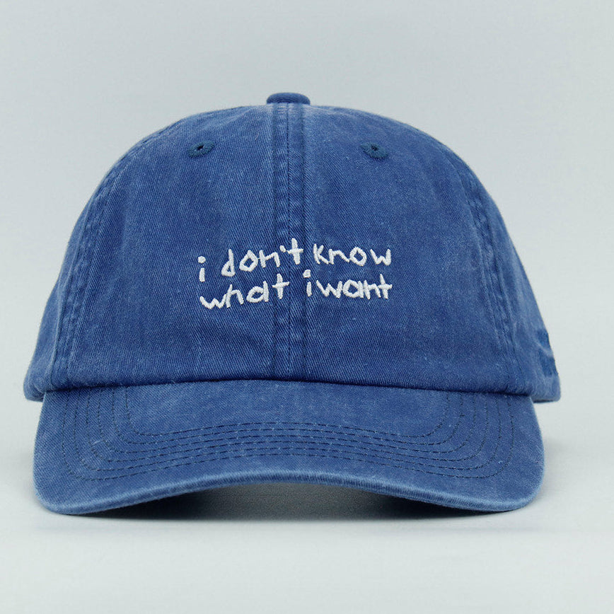 Blue cap with 'i don't know what i want' embroidered text