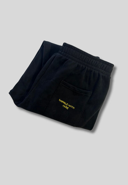 Pantalones deportivos Handle With Care