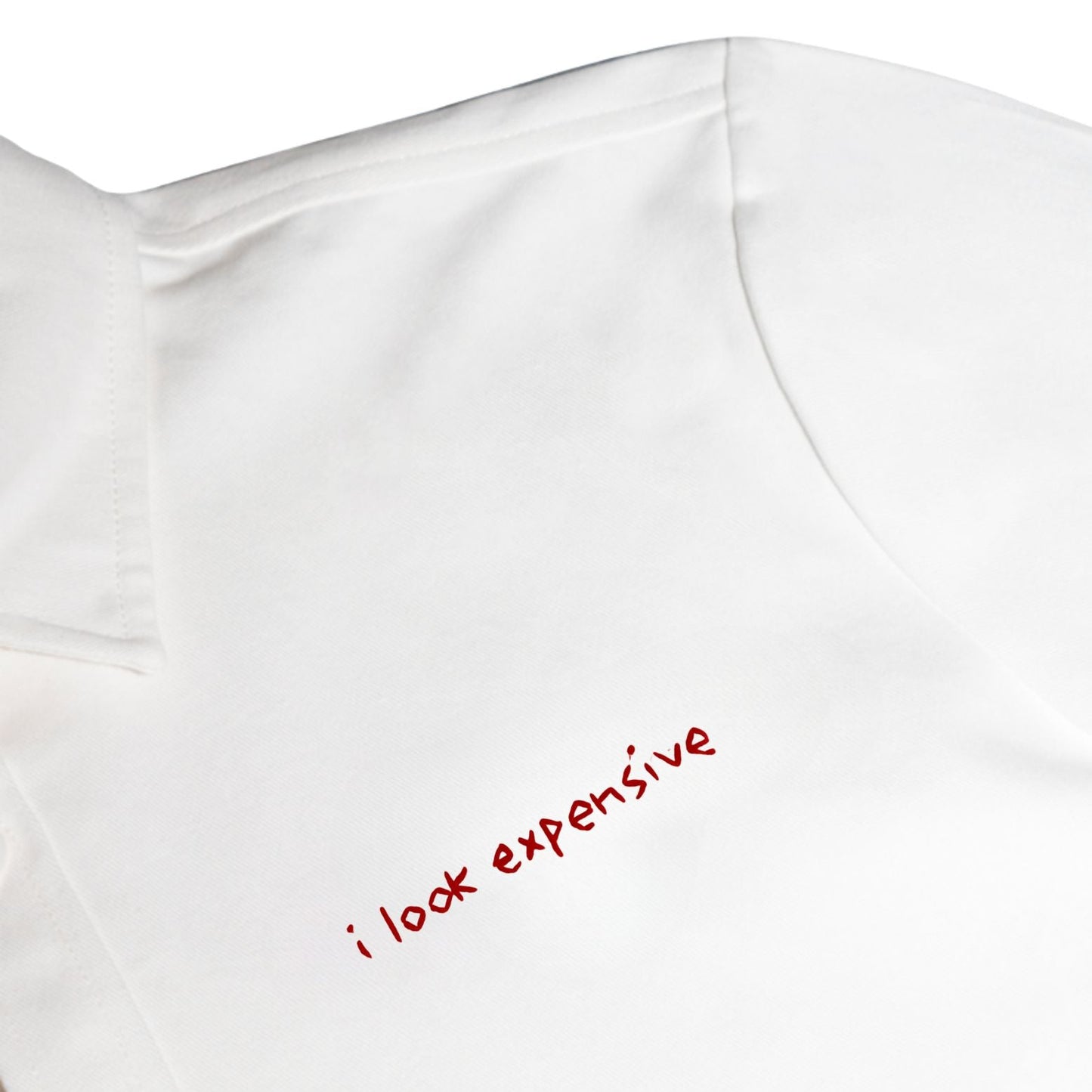 White shirt with red text 'i look expensive' on a white background
