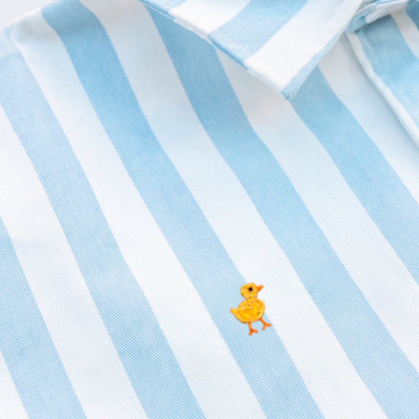 Blue and white striped shirt  with the duck embroidery