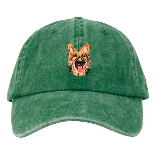 A green wash cap with a hand embroidered German Shepherd dog on the front.
