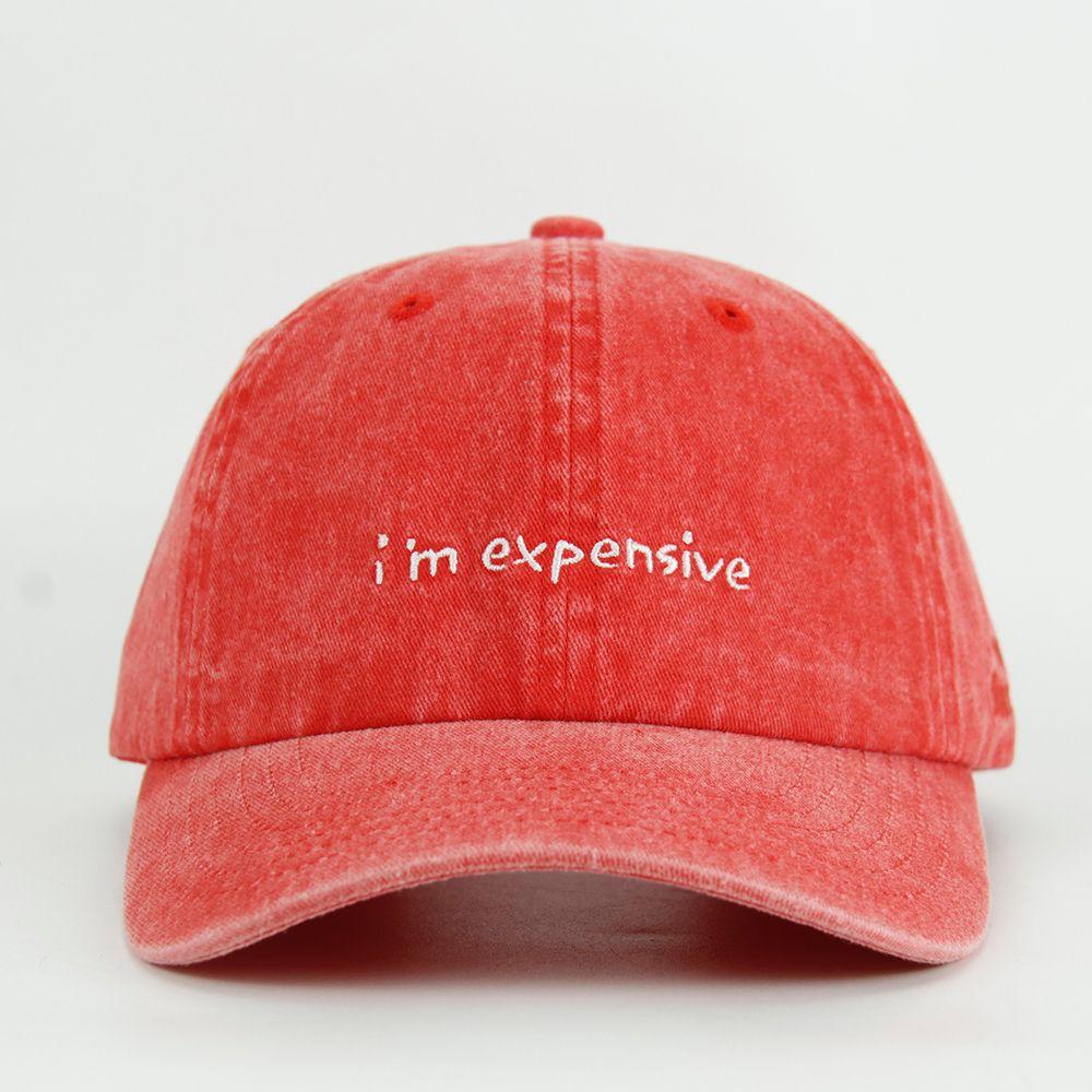 Red wash cap with 'i'm expensive' text on a white background