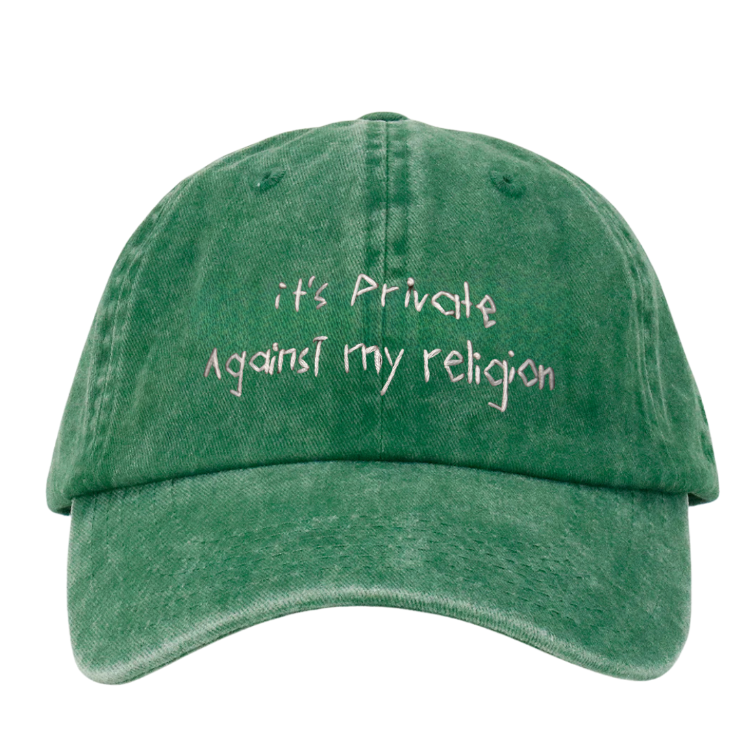 Green wash cap with text 'it's Private Against my religion' on a white background