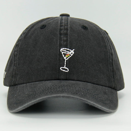 A black wash cotton baseball cap with a embroidered 'Martini' NY logo on the side, featuring an adjustable strap at the back.