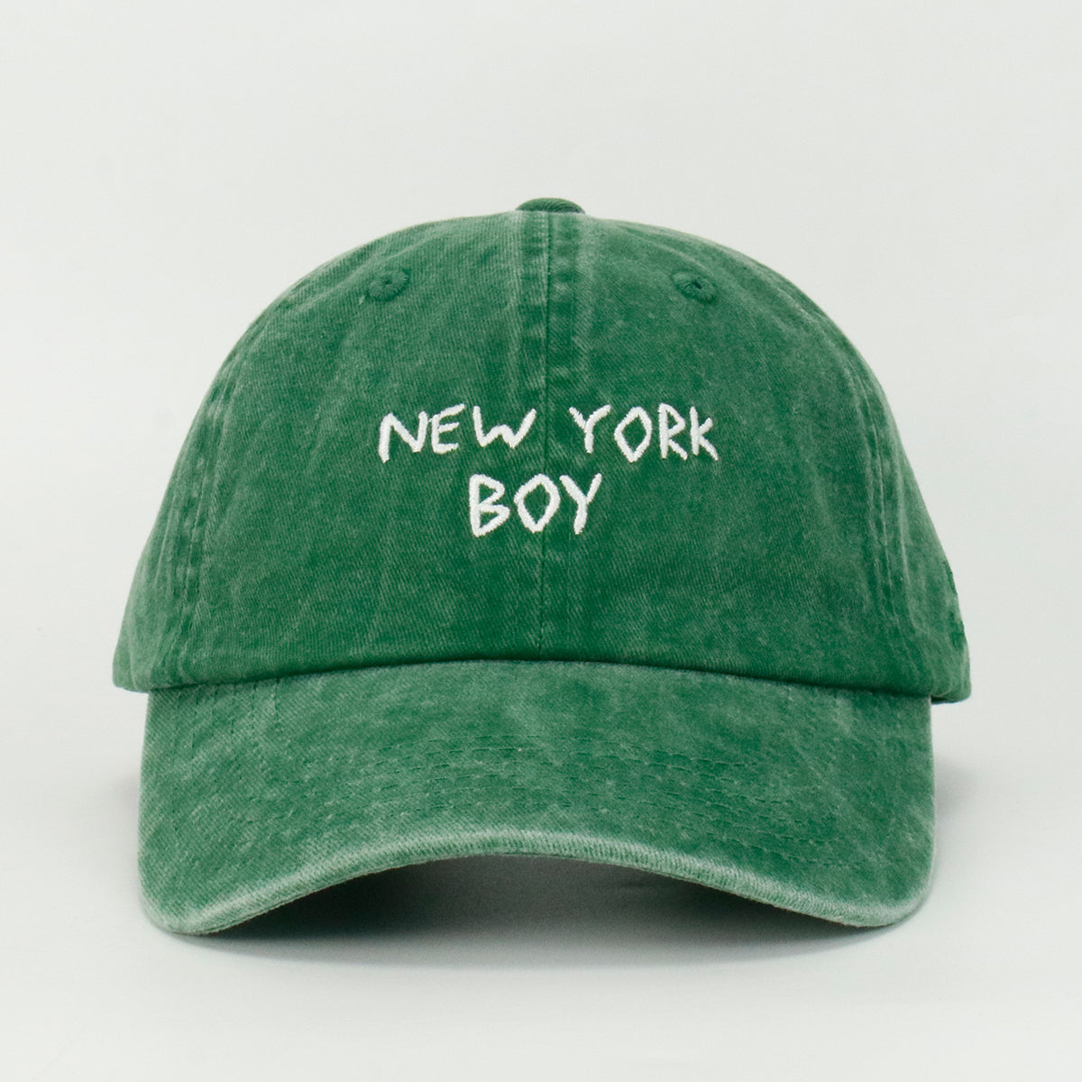 Green washed baseball cap with 'NEW YORK BOY' embroidered on the front