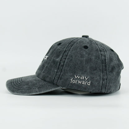 A washed black baseball cap with 'NEW YORK GIRL' embroidered in white on the front.