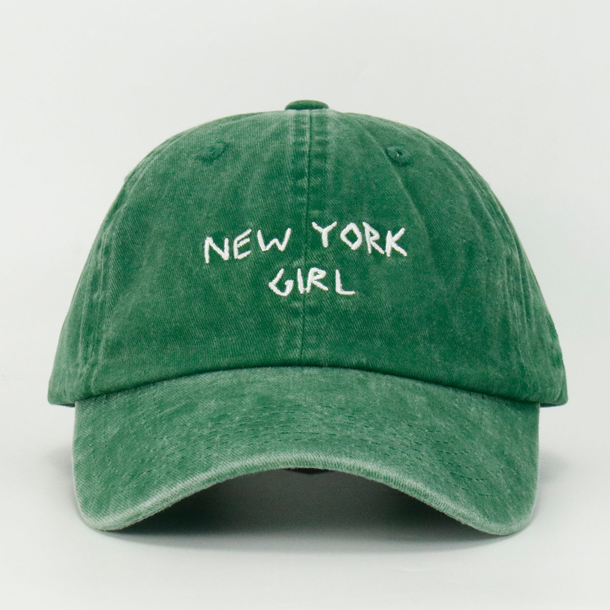 Washed Green baseball cap with 'NEW YORK GIRL' embroidered on the front