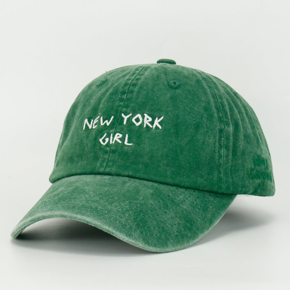 Washed Green baseball cap with 'NEW YORK GIRL' embroidered on the front