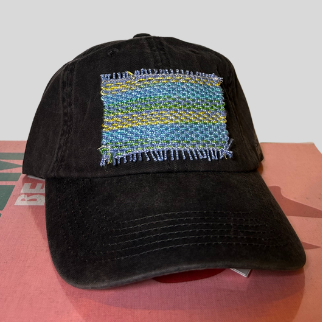 A black cap with a multicolored patch on the front.