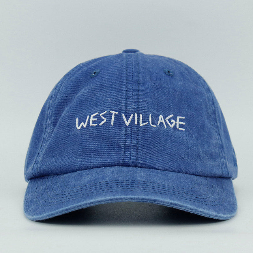 Blue cap with 'West Village'embroidery text