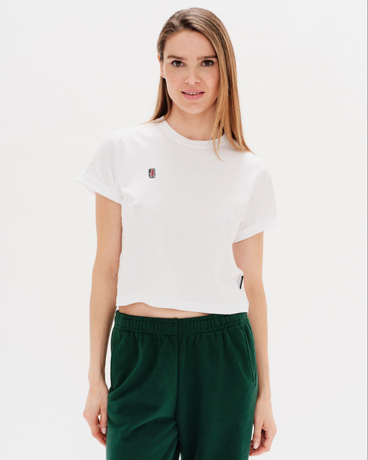 Woman wearing a white t-shirt with a diet coke embroidery