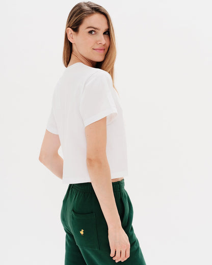 Woman wearing a white t-shirt with a diet coke embroidery