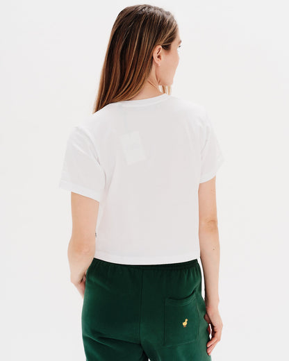 Woman wearing a white t-shirt with a diet coke embroidery