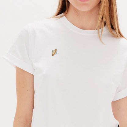 Woman wearing a white t-shirt with a planet embroidery