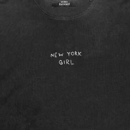 Black t-shirt with 'NEW YORK GIRL' text on a plain background