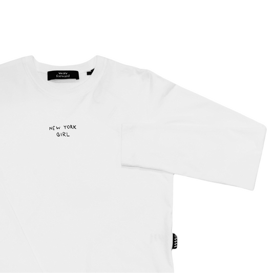 A long sleeve white crop tee with 'New York Girl' embroidery on the chest area, displayed against a plain background.