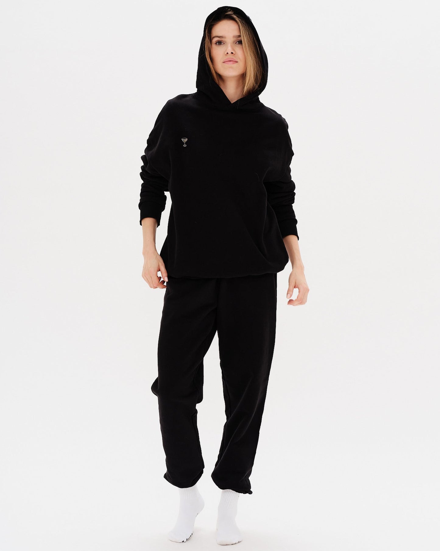 Woman wearing a premium black hoodie and pants