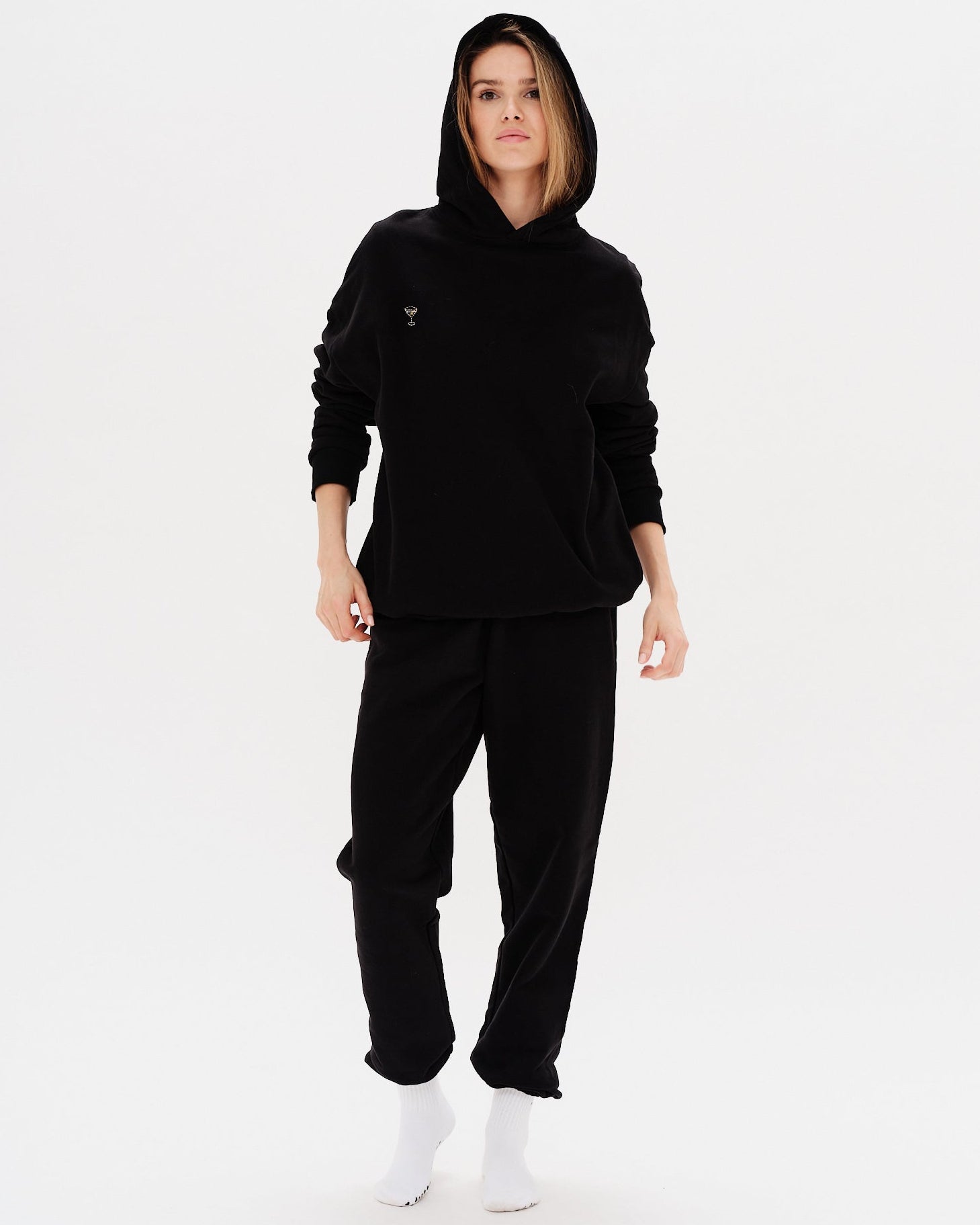 Woman wearing a premium black hoodie and pants