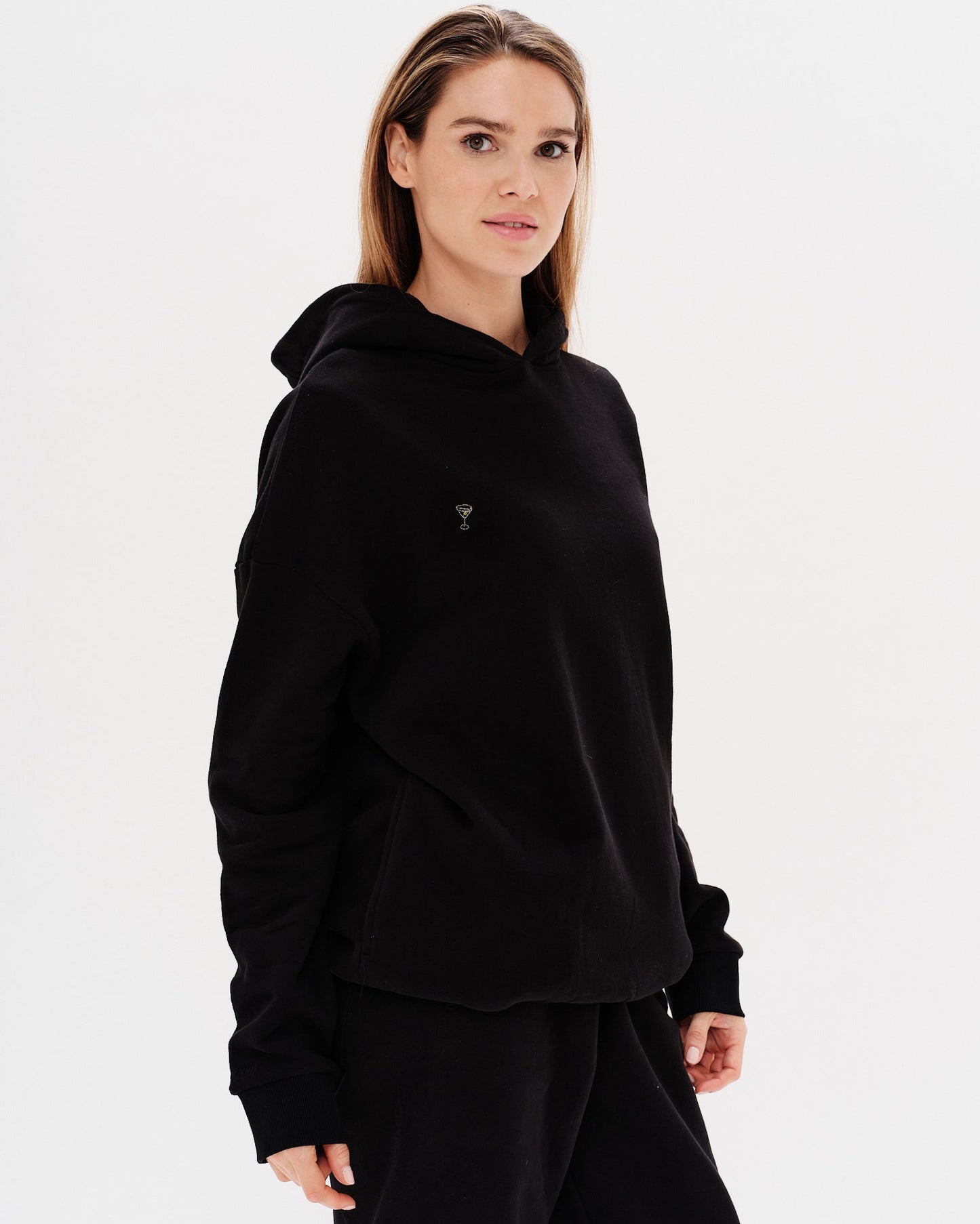 Woman wearing a premium black hoodie and pants