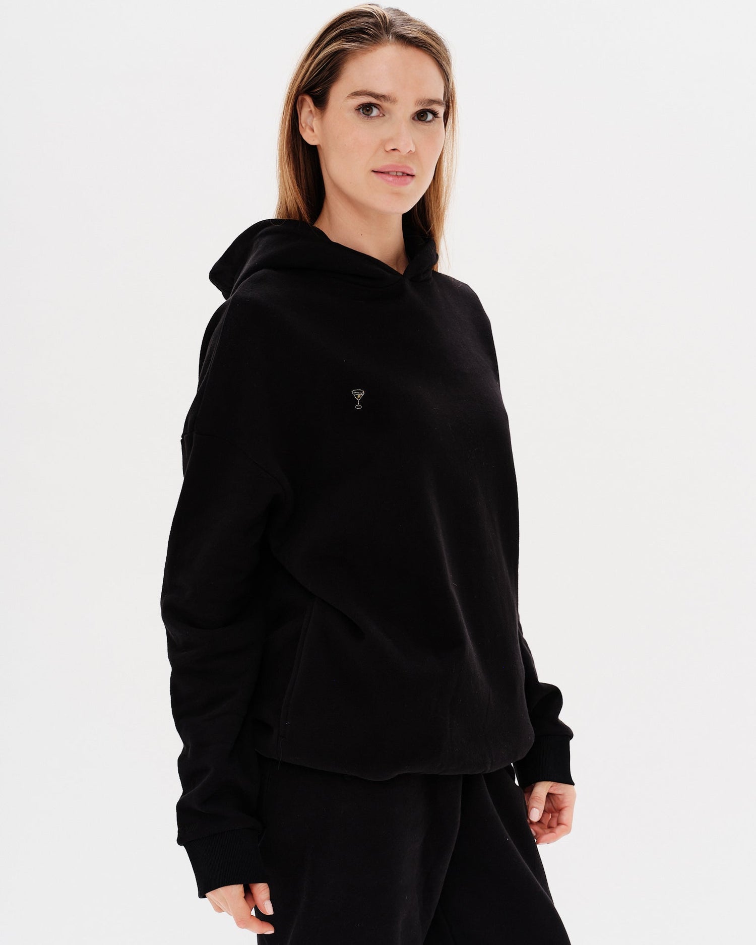Woman wearing a premium black hoodie and pants