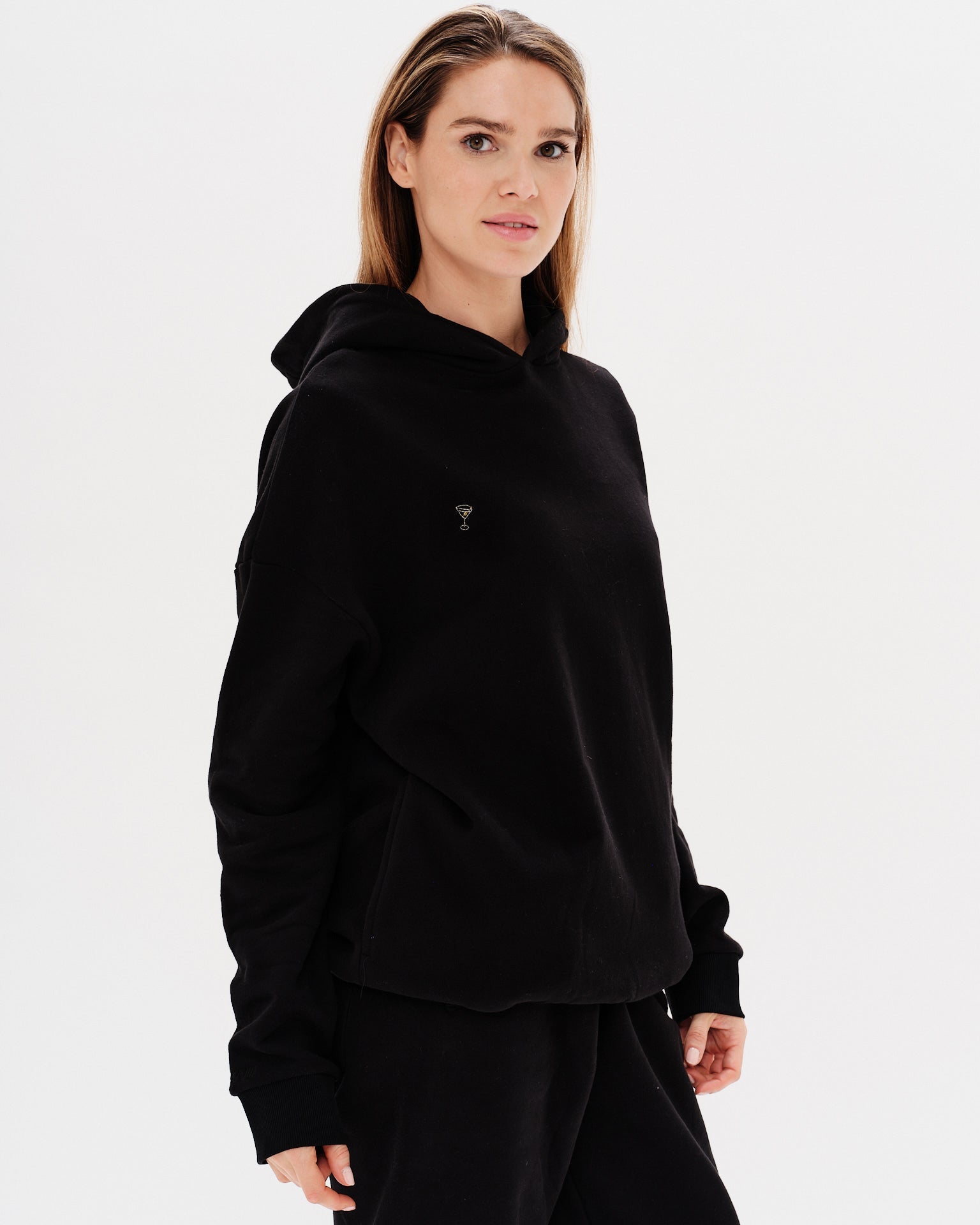 Woman wearing a premium black hoodie and pants