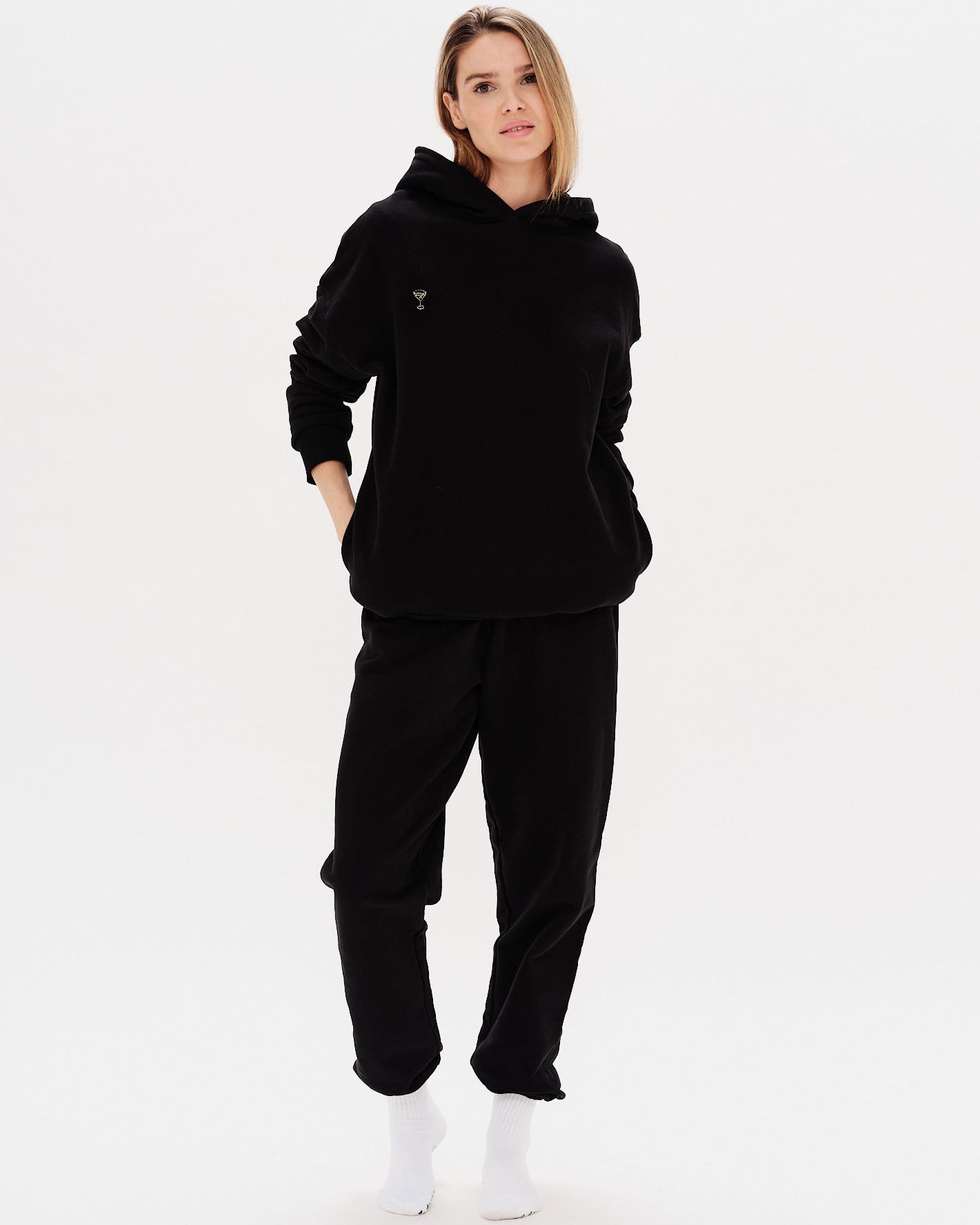 Woman wearing a premium black hoodie and pants