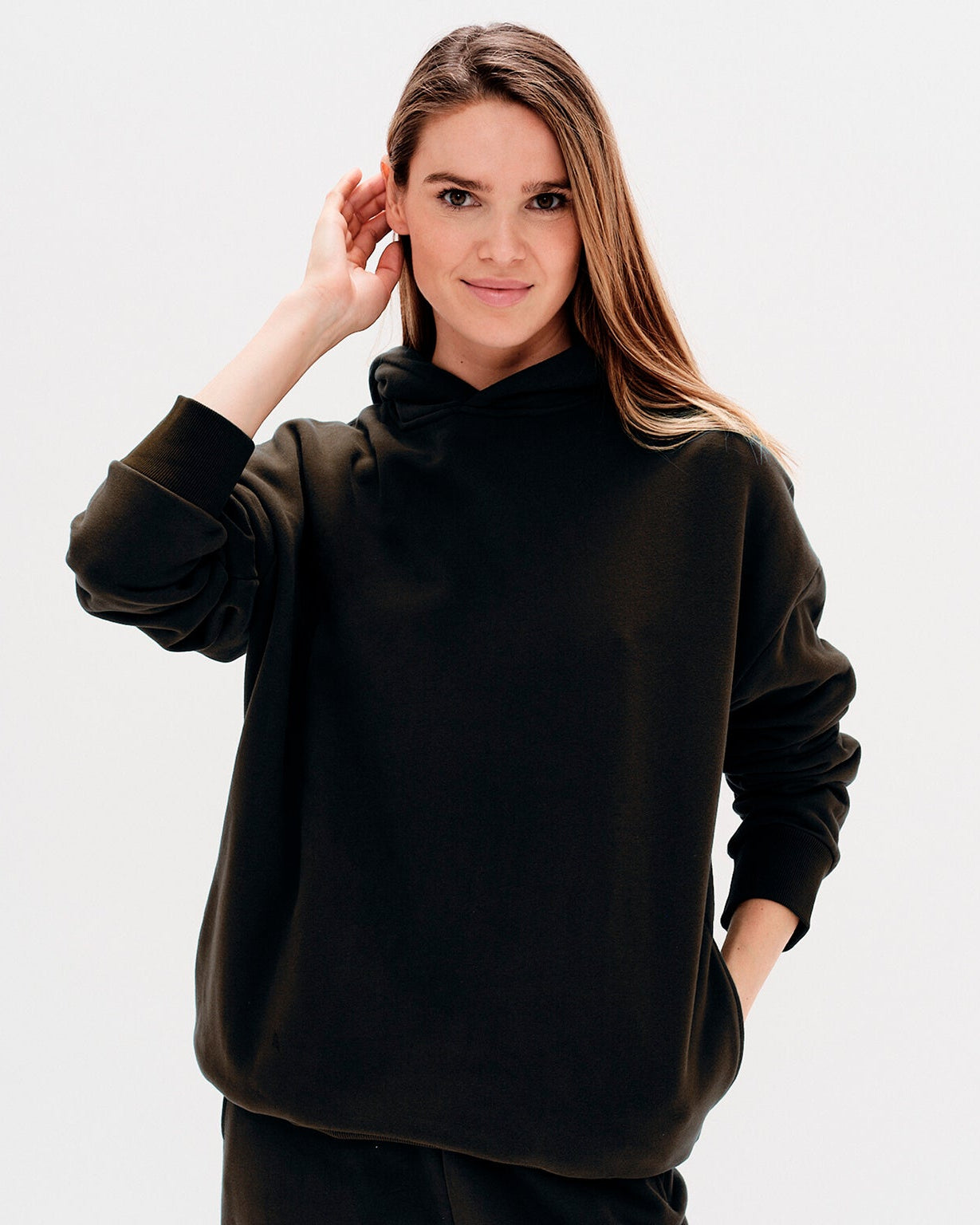 Woman wearing a black hoodie