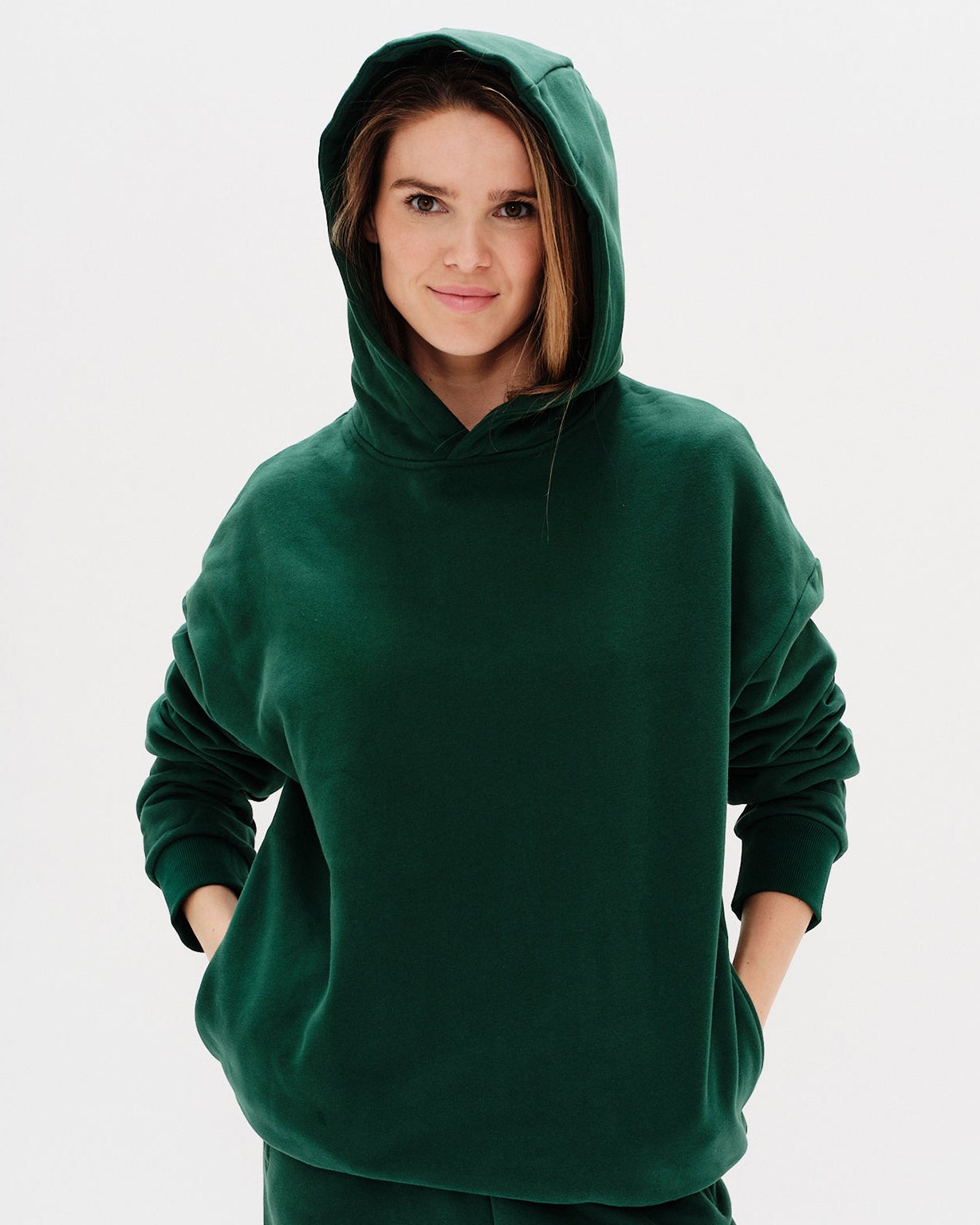 Woman wearing a green hoodie
