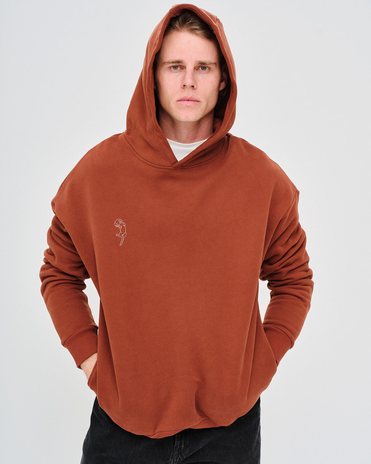Man wearing a brown hoodie