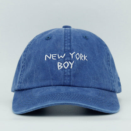 Blue cap with 'New York Boy' embroidered text 