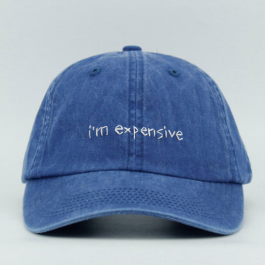 Blue cap with 'i'm expensive' embroidery text