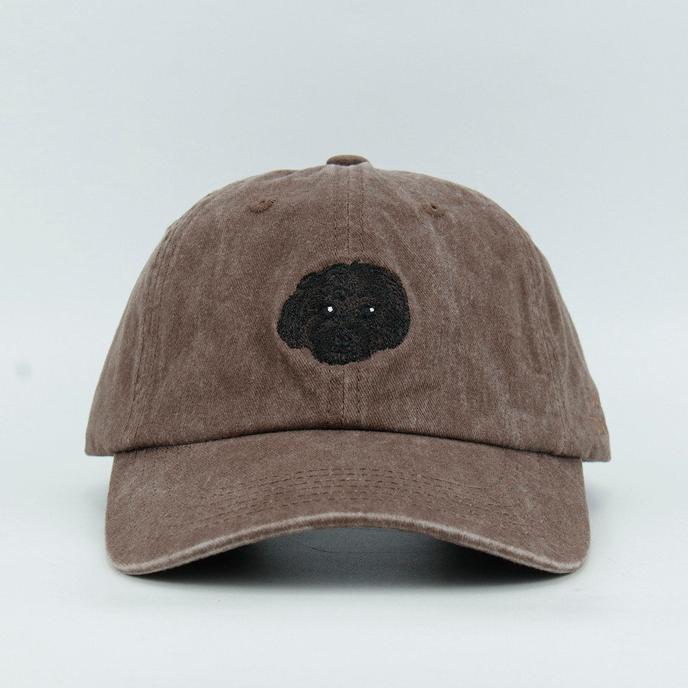 Brown cap with a black dog embroidery