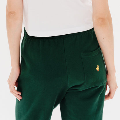 Woman wearing green pants with duck embroidery