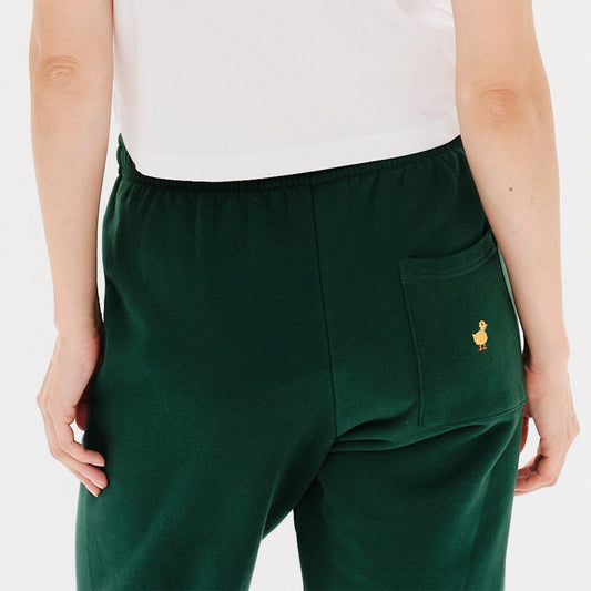 Woman wearing green pants with duck embroidery