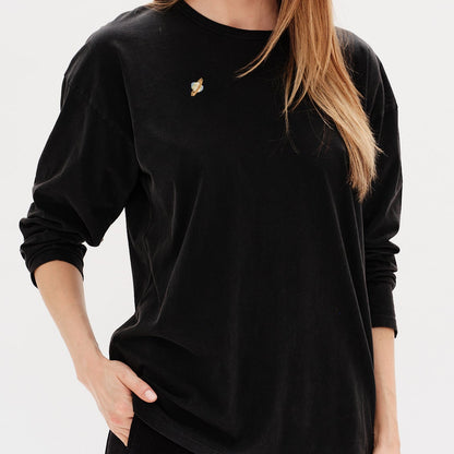 Woman wearing a black long-sleeve t-shirt with a planet embroidery