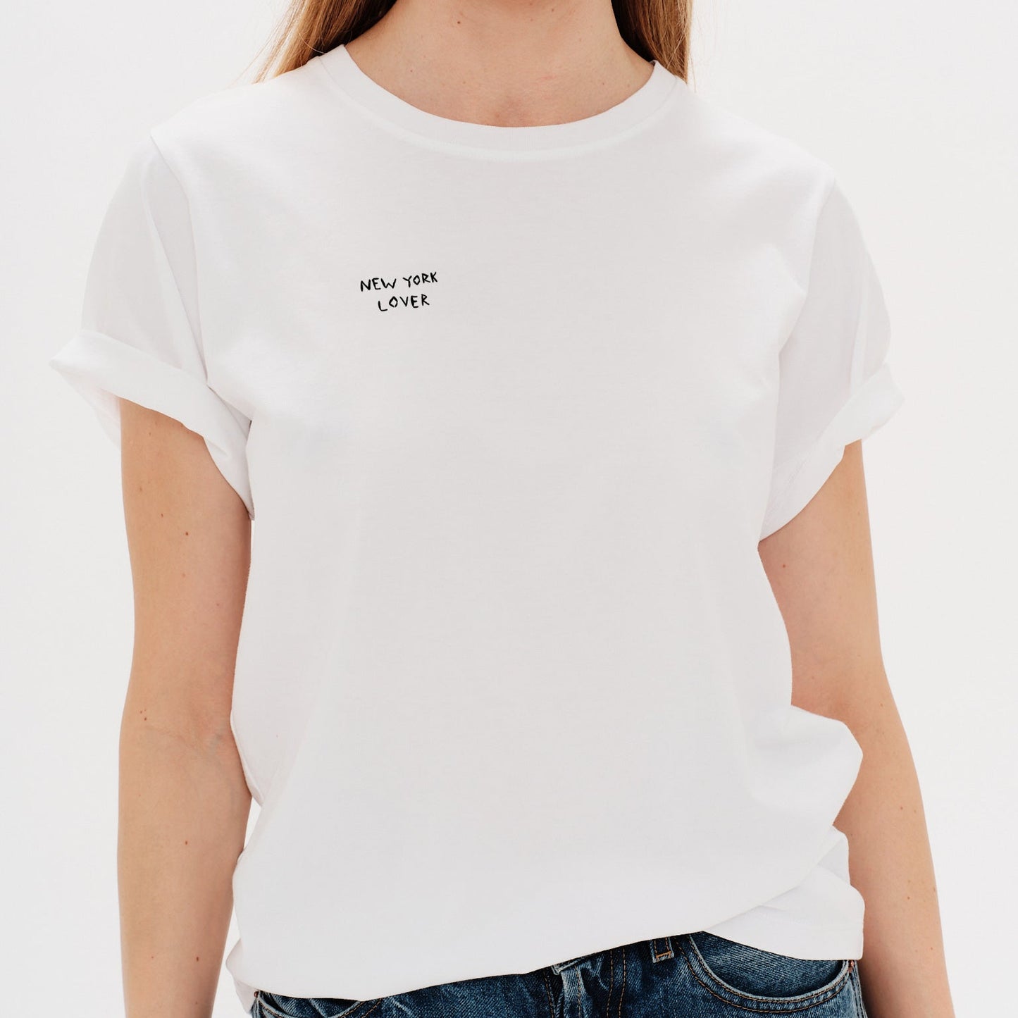 Woman wearing a white t-shirt withNew York Lover embroidery