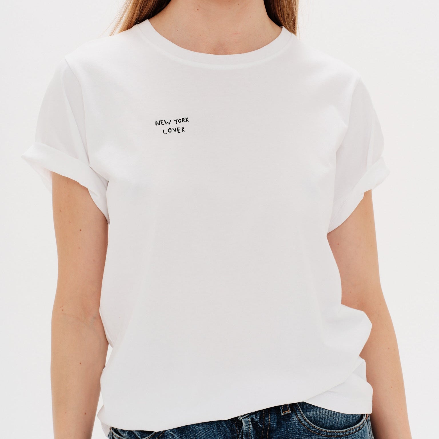 Woman wearing a white t-shirt withNew York Lover embroidery