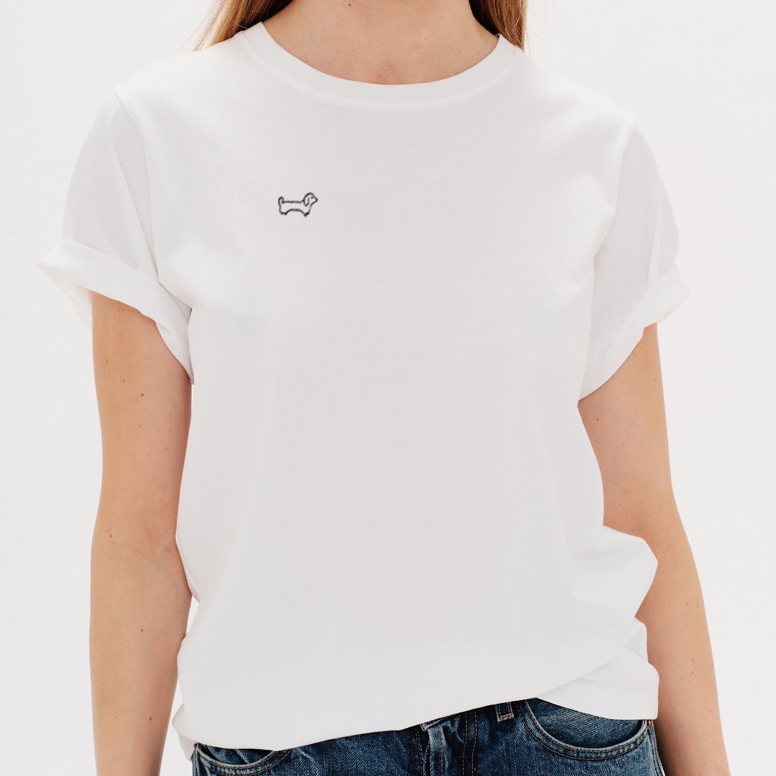 Woman wearing a white t-shirt with Wiener Dog embroidery