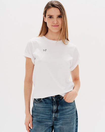 Woman wearing a white t-shirt with Wiener Dog embroidery
