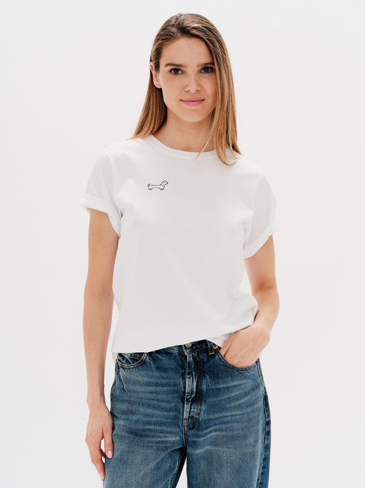 Woman wearing a white t-shirt with Wiener Dog embroidery