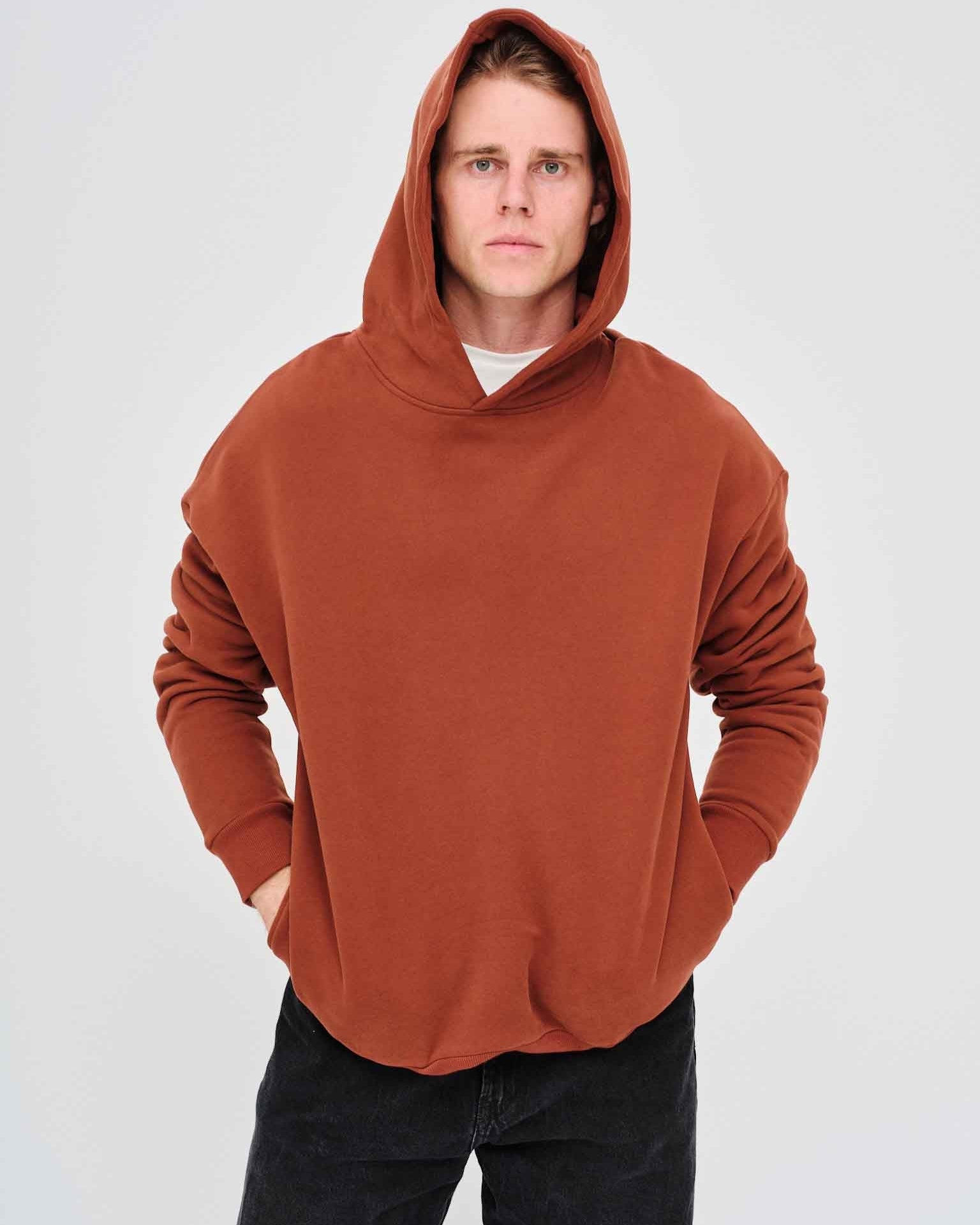 Man wearing a brown hoodie