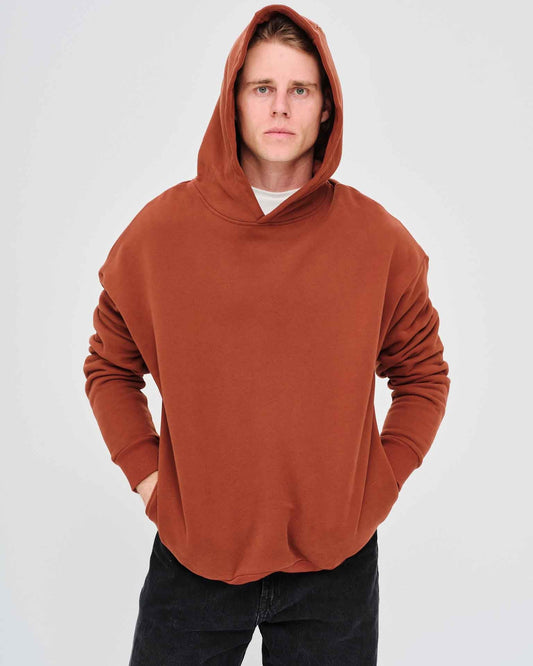Man wearing a brown hoodie