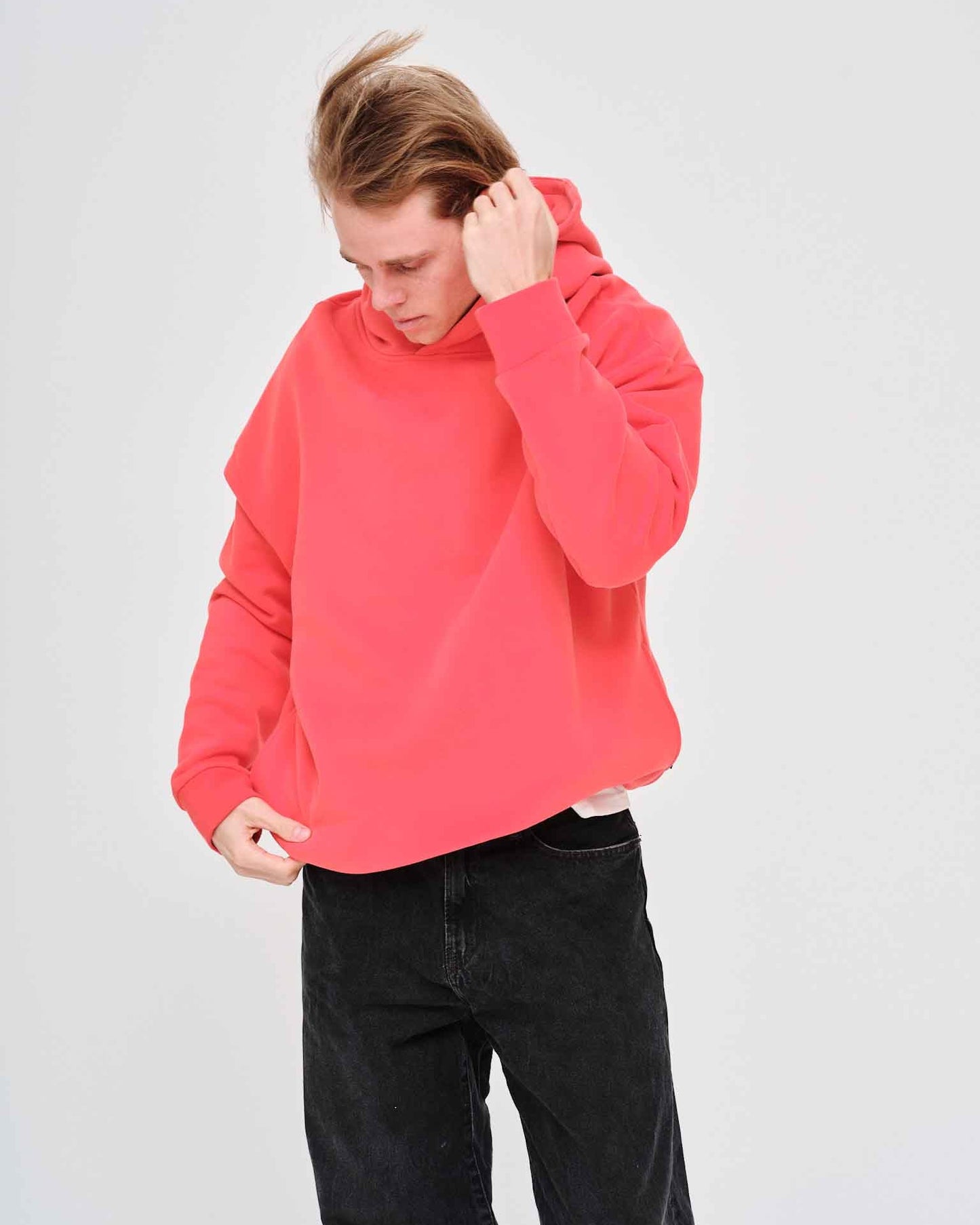 Man wearing an orange hoodie 