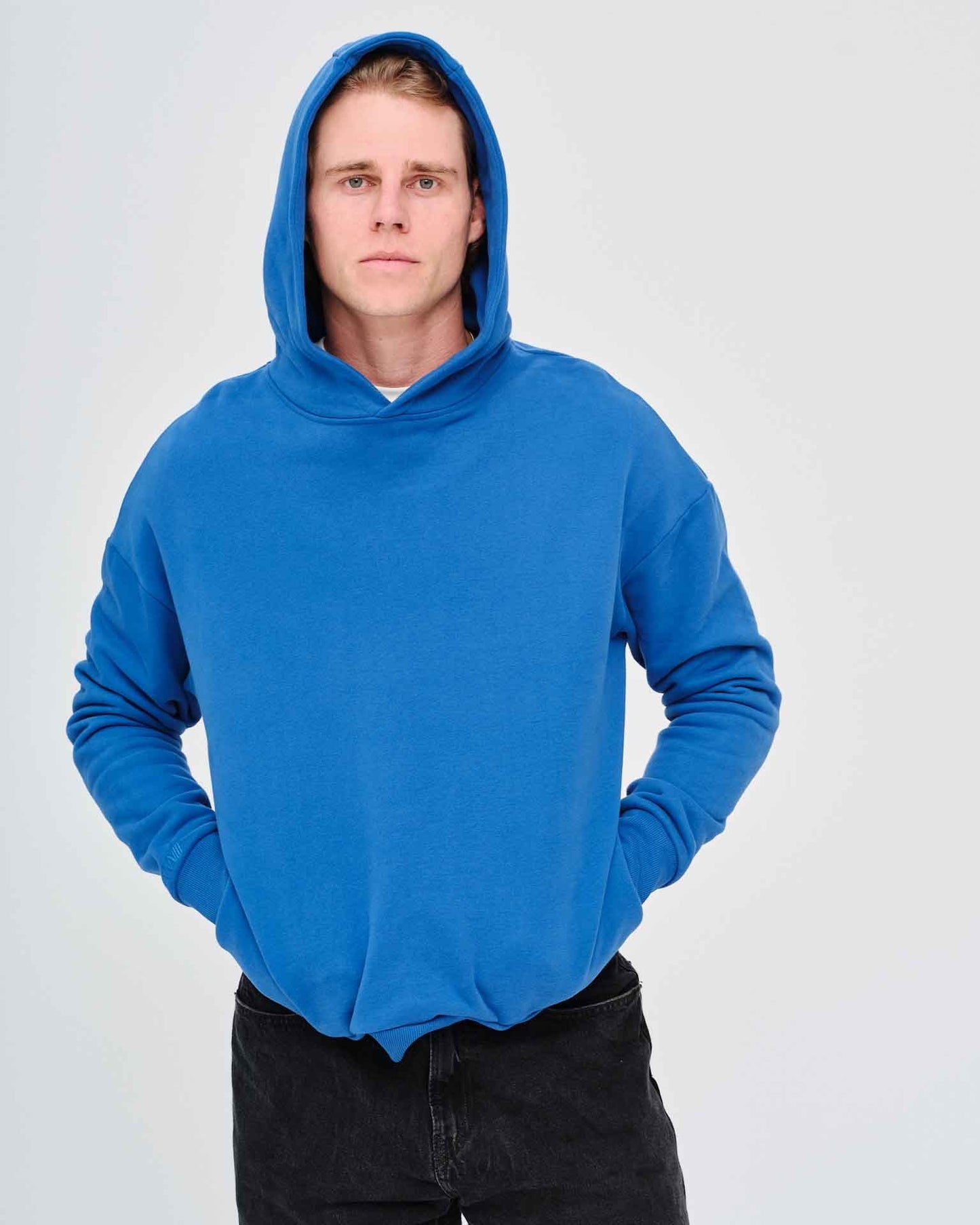 Man wearing a blue hoodie 